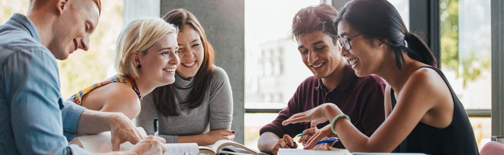 group of students talking and studying together