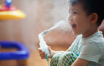 boy with nebulizer