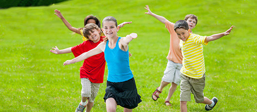 Kids running through field