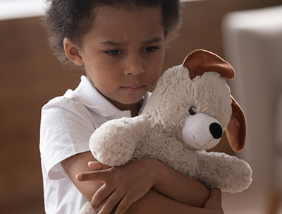 Little boy holding a teddy bear