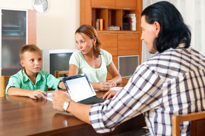 Mother and Child Talking to a Doctor