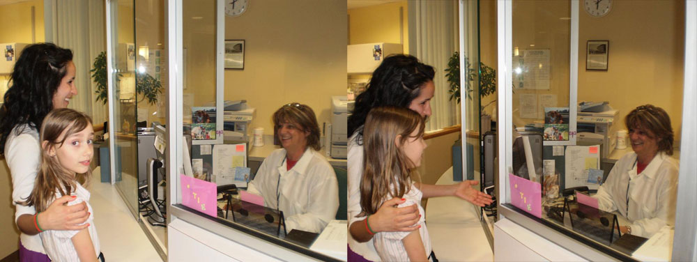 Mother and patient checking in at the front desk