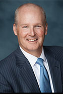 Steve Carl in blue tie and striped suit
