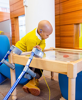 Myles playing in the lobby at Golisano Children's Hospital