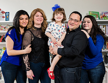 Gabby with her parents Kim and Steve, and siblings Alexandria and Emily.