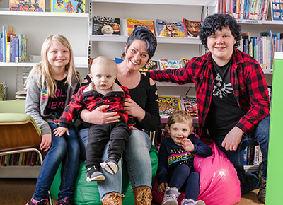 Sister Abbie, brother Aiden, and mother Candace with Luke and Lilly