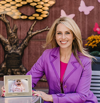 jennifer Johnson with photo of daughter Grace, in Grace's Garden at the Golisano Children's Hospital.