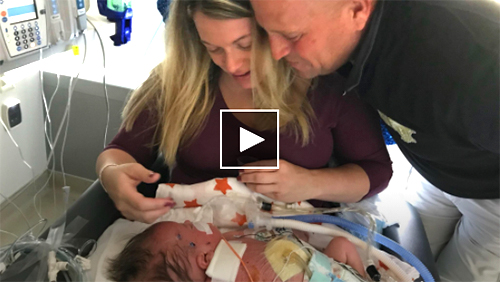 Wyatt Robson is pictured with his parents, Sarah and Jeff.