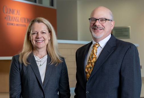 Wilson and Zand stand in front of the Clinical and Translational Science Institute sign in the Saunders Research Building