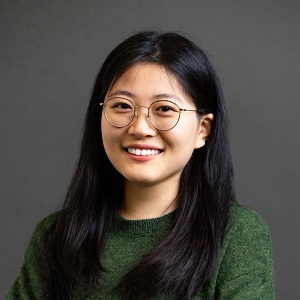 Zhao Yang portrait, black hair, glasses, green shirt