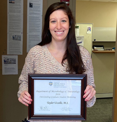 Photo of Taylor Uccello with award