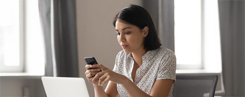 women looking at her smart phone