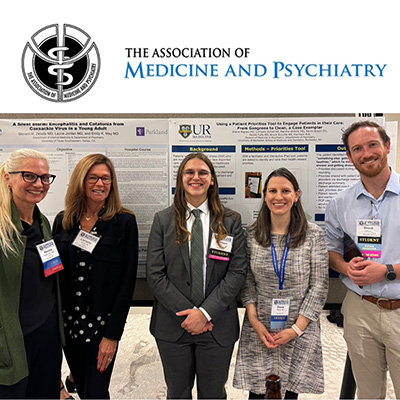 Researchers standing in front of poster