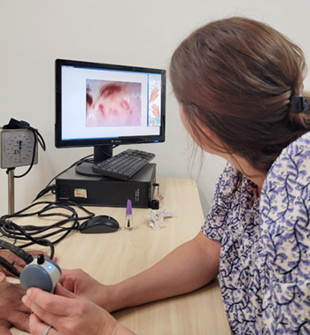 Provider examines patient hand