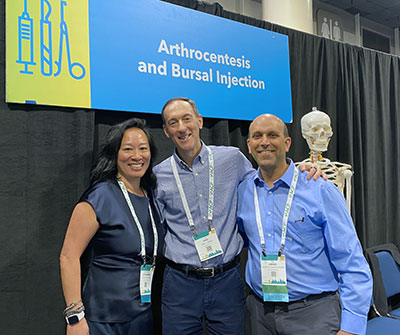 Catherine Tan, MD, Eric Anish, MD, and Diego Cahn-Hidalgo, MD, pose at the ACP Internal Medicine meeting