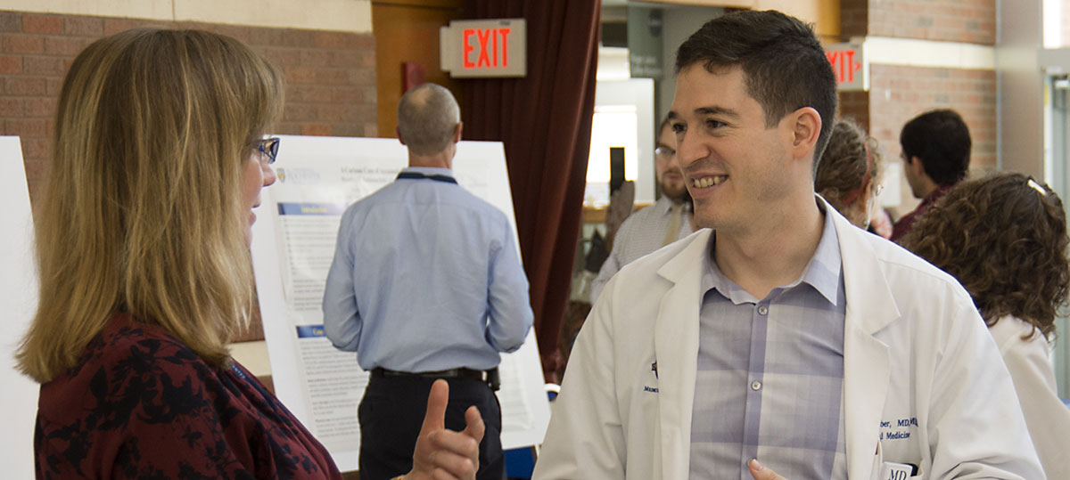 Drs. Valerie Lang and Conrad Gleber at Resident Poster Day