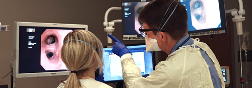 Doctors performing a bronchoscopy