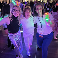 Left to right: Heather Lander, MD, Annie Medina-Walpole, MD, and Jennifer Muniak having fun at the AGS Dance Party.