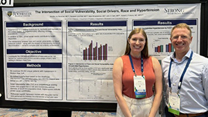 Jennifer Joy Beuschel and Robert Fortuna with their SGIM poster