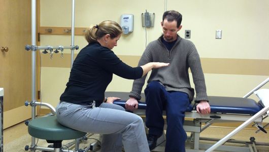 nurse doing PT with patient