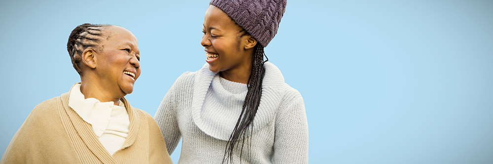 older women smiling at younger woman