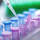 Colored test tubes with a pipette