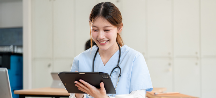 Medical student working on a tablet