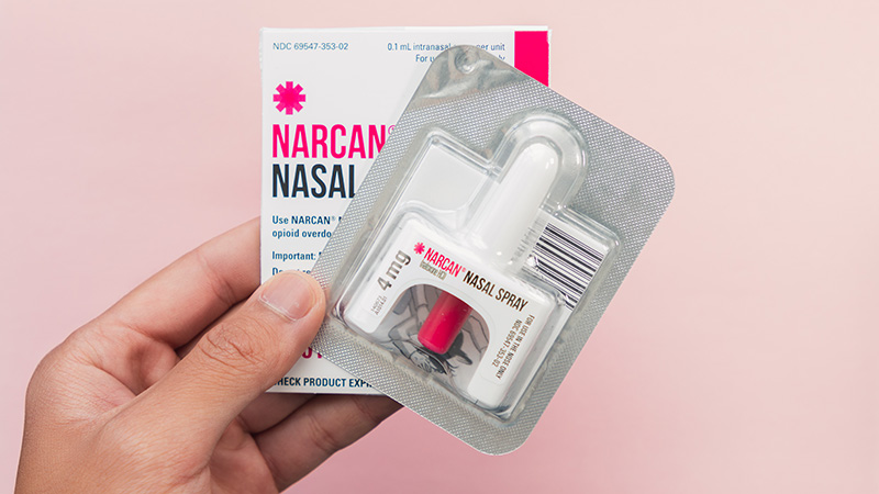 Person holding Narcan Nasal Spray