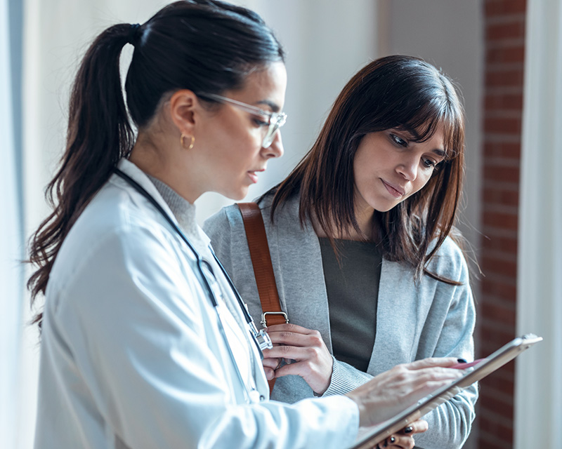 doctor talking with woman