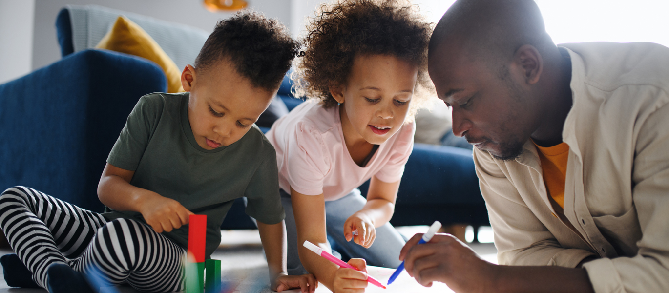 father and children drawing