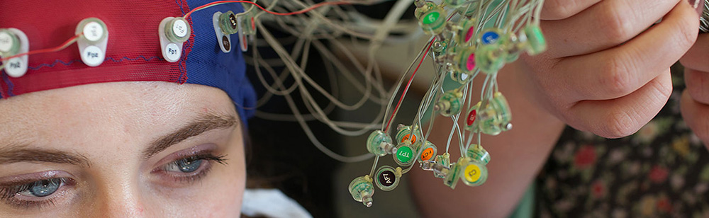 a women having sensors attached to head