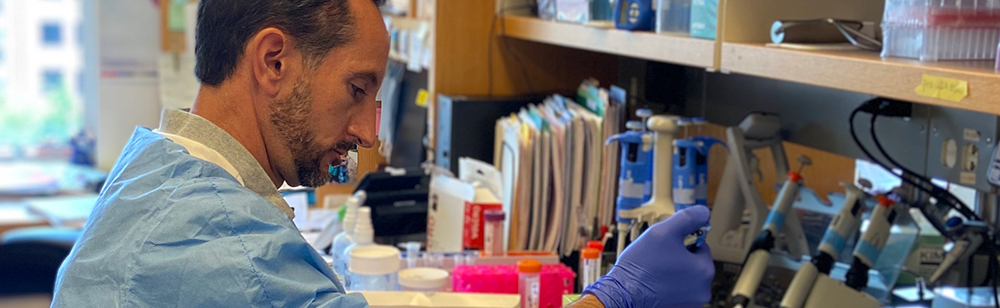 Jeff Malik, Staff Scientist, working at lab bench