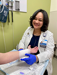 Provider attending to a patient's wound