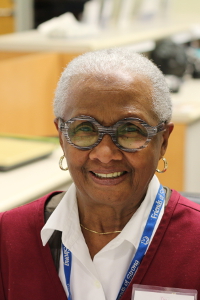 Betty McClenney volunteers at the family waiting room reception desk.