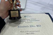 Elizabeth Ellis Holding Trophy with Award