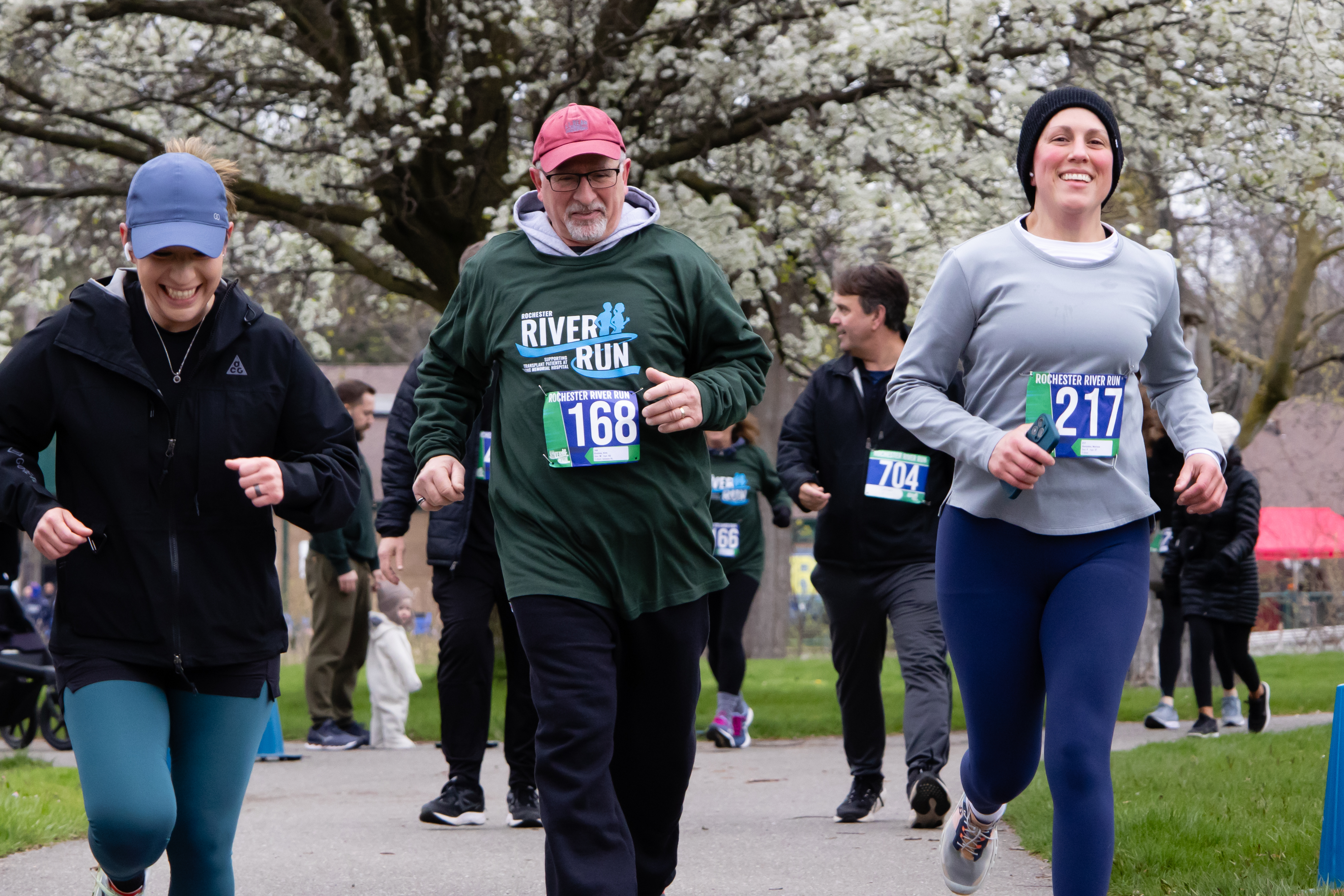 Three runners at the finish line