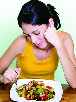 Woman eating salad